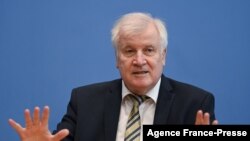 German Interior Minister Horst Seehofer addresses a joint press conference with the president of the The Federal Office for Information Security (BSI) in Berlin, Oct. 21, 2021. 