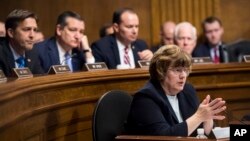 Phoenix prosecutor Rachel Mitchell questions Christine Blasey Ford as, from left, Sen. Ben Sasse, R-Neb., Sen. Ted Cruz, R-Texas, Sen. Mike Lee, R-Utah., and Sen. John Cornyn, R-Texas, listen during the Senate Judiciary Committee hearing, Sept. 27, 2018 on Capitol Hill in Washington.