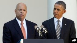 President Barack Obama stands with Jeh Johnson, his choice for the next Homeland Security Secretary, in the Rose Garden at the White House in Washington, Oct. 18, 2013. 
