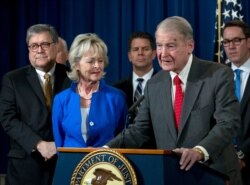 FILE - Former FBI Director William Webster, who was targeted by a man who peddled a lottery scam via phone calls and emails, addresses elder financial exploitation, at the Justice Department in Washington, March 7, 2019.