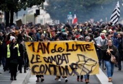 Protesters attend a demonstration to mark the first anniversary of the "yellow vest" movement in Nantes, France, Nov. 16, 2019.