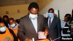 FILE - Opposition UPND party presidential candidate Hakainde Hichilema casts his ballot in Lusaka, Zambia, Aug. 12, 2021.
