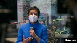 FILE - Rappler CEO and Executive Editor Maria Ressa speaks to the media after pleading not guilty to tax evasion charges, in Rappler's office in Pasig City, Metro Manila, Philippines, July 22, 2020.