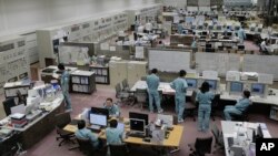 FILE - The Rokkasho spent nuclear fuel reprocessing plant control center, run by Japan Nuclear Fuel Ltd. (JNFL) in Rokasho village in Aomori Prefecture, northern Japan, Nov. 8, 2012. JNFL postponed the plant's opening to as late as Sept. 2018, citing regulators' lengthy inspection procedures and time needed for safety upgrades.