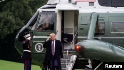 FILE - U.S. President Donald Trump walks from Marine One as he returns from campaign travel to Bedminster, New Jersey, on the South Lawn of the White House in Washington, Oct. 1, 2020.