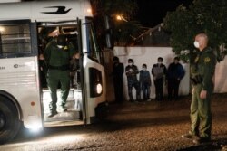 Unaccompanied minor migrants wait to be transported by the U.S. Border Patrol after crossing the Rio Grande river into the United States from Mexico in Roma, Texas, Aug. 14, 2021.