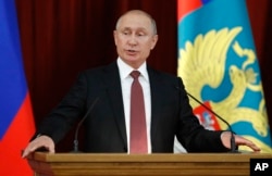Russian Vladimir Putin speaks during a meeting with Russian ambassadors to foreign countries in Moscow, July 19, 2018.