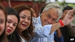 Sebastian Pinera, former Chilean President and current presidential candidate for a coalition parties called Chile Vamos, waves to supporters during a campaign rally in Santiago, Chile, Nov. 15, 2017.