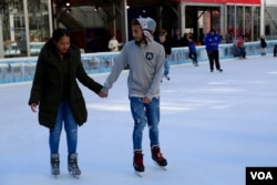 “It’s definitely nerve-wracking,” said Robin Pacheco, left, in anticipation of final election day results. “I don’t even know how to describe it. It’s scary," Nov. 7, 2016. (R. Taylor/VOA)
