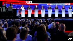 FILE - Democratic presidential hopefuls participate in a debate hosted by CNN/New York Times at Otterbein University, in Westerville, Ohio, Oct. 15, 2019.