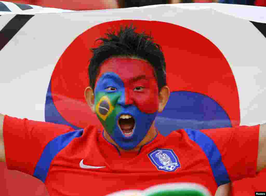 A fan of South Korea shouts before their match against Algeria at the Beira Rio stadium in Porto Alegre, June 22, 2014.