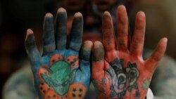 Author Hiroki Takamura, 62, shows tattoos on his palms at the annual gathering of the Irezumi Aikokai (Tattoo Lovers Association) in Tokyo, Japan, February 16, 2020. REUTERS/Kim Kyung-Hoon