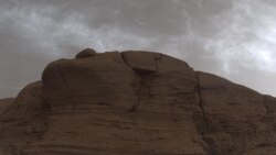 NASA’s Curiosity Mars rover captured these clouds just after sunset on March 19, 2021. The image is made up of 21 individual images stitched together and color-corrected so that the scene appears as it would to the human eye. (Photo Credit: NASA/JPL-Caltech)