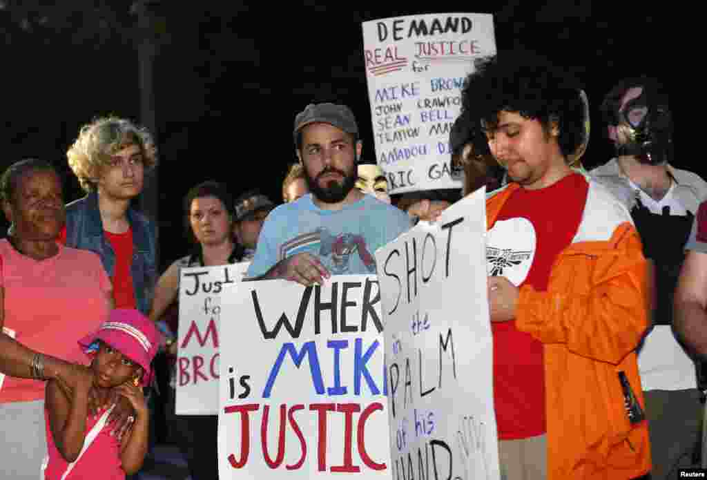 People gather outside the White House as part of a &quot;National Day of Rage&quot; protest against the fatal shooting of Michael Brown in Ferguson, Missouri, Aug. 21, 2014.
