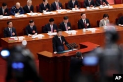 FILE - Chinese President Xi Jinping delivers a speech at the closing session of the annual National People's Congress (NPC) at the Great Hall of the People in Beijing, Tuesday, March 20, 2018.