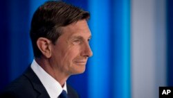 President incumbent Borut Pahor looks at his counter-candidates ahead of a televised debate at Slovenia's public TV, in Ljubljana, Slovenia, Oct. 19, 2017. Slovenia, the Alpine home country of Melania Trump, is holding a presidential election Sunday that incumbent President Borut Pahor is favored to win. 