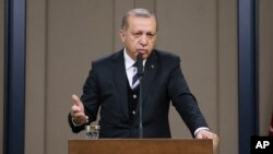 Turkey's President Recep Tayyip Erdogan makes a statement prior to his trip to China, which will be followed by a trip to Washington, in Ankara, Turkey, May 12, 2017. 