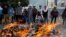Opposition supporters stand in front of a fire during clashes with riot police at a rally against President Nicolas Maduro in Caracas, Venezuela, May 3, 2017.