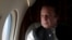FILE - Pakistani Prime Minister Nawaz Sharif looks out the window of his plane after attending a ceremony to inaugurate the M9 motorway between Karachi and Hyderabad, Pakistan. Prime Minister Nawaz met Monday with Saudi King Shah Salman bin Abdul Aziz in Jeddah, but no progress was reported in resolving the crisis.