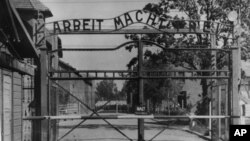 FILE - This undated photo shows the main gate of the Nazi concentration camp Auschwitz, in Poland, which was liberated by the Russians in January 1945.