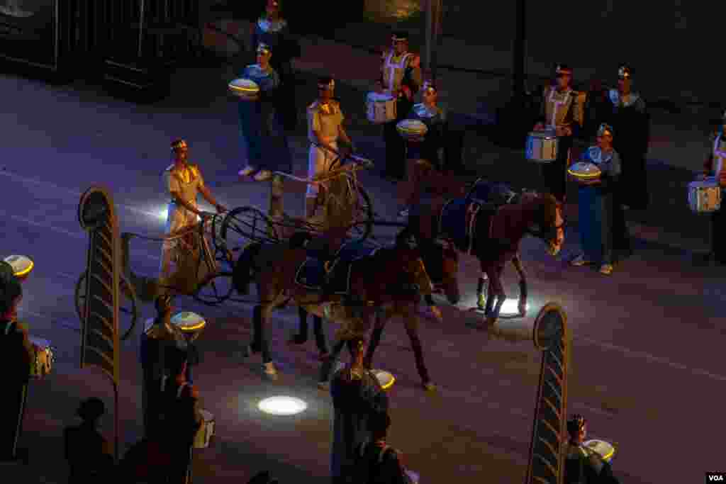 Performers in chariots ride through the streets, April 3, 2021. (Hamada Elrasam/VOA) 