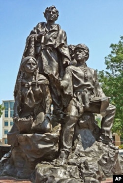 The Native American guide Sacagawea stand with explorers Meriwether Lewis and William Clark on a sculpture. (FILE PHOTO)
