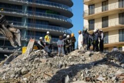 FILE - Search and rescue personnel work at the site of a collapsed Florida condominium complex in Surfside, July 2, 2021. (Miami-Dade Fire Department photo)