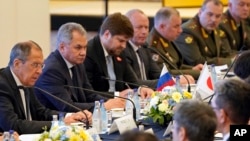 Russian Foreign Minister Sergei Lavrov (L) and Defense Minister Sergei Shoigu (2nd-L) attend a meeting with Japanese Foreign Minister Taro Kono and Defense Minister Takeshi Iwaya at the Iikura guest house in Tokyo, May 30, 2019. 