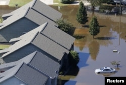 Flooding waters of theTar River cover the Riverwalk Apartments due to rainfall caused from Hurricane Matthew in Greenville, North Carolina, Oct. 11, 2016.