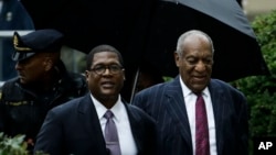 Bill Cosby, right, arrives for his sentencing hearing at the Montgomery County Courthouse, Sept. 25, 2018, in Norristown, Pennsylvania.