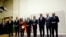 EU foreign policy chief Catherine Ashton, third from left, delivers statement during ceremony marking deal between Iran, six world powers, United Nations, Geneva, Nov. 23, 2013.