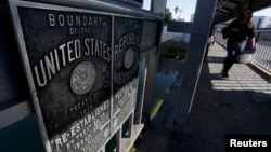 A Cuban migrant crosses a pedestrian bridge to Laredo, U.S., after arriving by plane from Costa Rica to Nuevo Laredo, Mexico, Feb. 10, 2016. About 246 Cuban migrants stranded in Costa Rica arrived in Mexico's border city of Nuevo Laredo as part of a pilot program agreed by Central American countries last year to allow the migrants to continue towards the United States. 