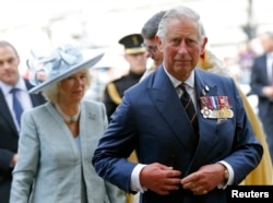 FILE - Britain's Prince Charles and his wife Camilla, Duchess of Cornwall arrive at Westminster Abbey in central London, May 10, 2015.