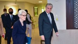 In this photo released by Pakistan's Ministry of Foreign Affairs, visiting U.S. Deputy Secretary of State Wendy Sherman, left, and Pakistan's Foreign Minister Shah Mahmood Qureshi, right, walk together at the Ministry of Foreign Affairs in Islamabad, Oct. 8, 2021.