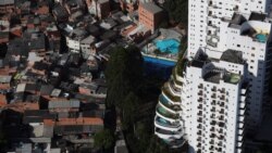 An aerial view shows the city's biggest slum Paraisopolis next to luxury apartment buildings in Sao Paulo, Brazil April 2, 2020.