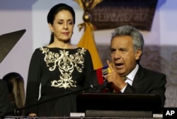 Ecuador's President Lenin Moreno gives a speech, as his wife Rocio Gonzalez listens to him, from government palace balcony in Quito, Ecuador, May 24, 2017.