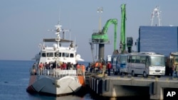 FILE - Migrants disembark after being apprehended by the Turkish coast guard on the Aegean Sea between Turkey and Greece, in Dikili port, Turkey, April 6, 2016. Observers say Ankara will likely refrain from jeopardizing deal on migrants it reached with the EU.
