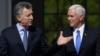 U.S. Vice President Mike Pence, right, walks with Argentina's President Mauricio Macri at the government residence in Buenos Aires, Argentina, Aug. 15, 2017. 