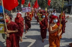 Buddhist monks lead a protest against the military coup in Mandalay, Myanmar, Feb. 16, 2021.
