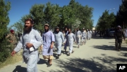 FILE - Prisoners are released from Bagram Prison in Parwan province, Afghanistan, May 26, 2020.