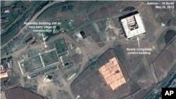 This May 26, 2013 satellite image taken by Astrium, and annotated and distributed by 38 North shows an unfinished new missile assembly building, top left, and control center, top right, at the Tonghae facility in North Korea. (AP Photo/Astrium - 38 North)
