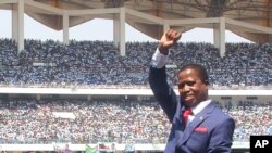 Zambia President Inaugurated: President Edgar Lungu of Zambia, waves to the crowd during his inauguration in Lusaka, Zambia, Tuesday, Sept. 13, 2016. 