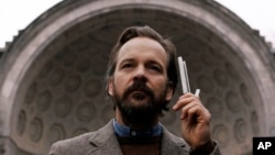 This image released by IFC Films shows Peter Sarsgaard in a scene from "The Sound of Silence." (IFC Films via AP)