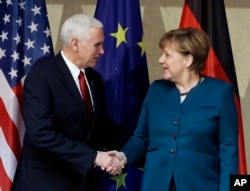 FILE - Germany Security ConferenceU.S. Vice President Mike Pence, left, and German Chancellor Angela Merkel meet for bilateral talks on the sidelines of the Munich Security Conference in Munich, Germany, Feb. 18, 2017.