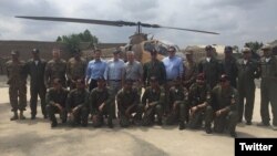 Members of a U.S. congressional delegation, headed by Republican Senator John McCain (6-L, 2nd row), pose for a picture with Dragon helicopter pilots from the Pakistani Air Force in Miramshah, North Waziristan, Pakistan, July 3, 2016. (@SenJohnMcCain)