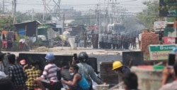Protesters face off against police in Mandalay, a city in Myanmar, March 3, 2021. (Htet Aung Khant/VOA Burmese)