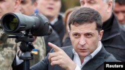 Ukrainian President Volodymyr Zelenskiy attends a joint drill of departments of Interior Ministry at the International training Centre near the village of Stare in Kyiv region, Ukraine, Sept. 30, 2019. 