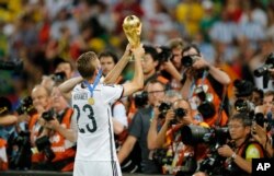 Christoph Kramer of Germany celebrates the World Cup title with fans in 2014. He missed most of the game due to a concussion.