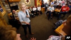 Democratic presidential candidate Sen. Kirsten Gillibrand speaks to local residents at a coffee shop, May 25, 2019, in Mason City, Iowa.