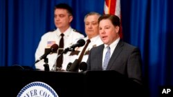 Carver County Attorney Mark Metz, right, announced April 19, 2018 in Chaska, Minnesota, that no criminal charges will be filed in the death of musician Prince in 2016. 